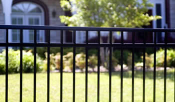 A black basic steel fence panel with three horizontal rails