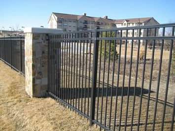 Black basic steel fencing are installed to secure a premise.